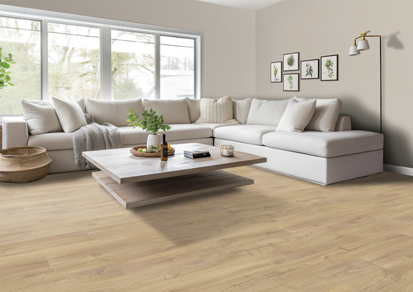 luxury vinyl plank flooring in living room with white couch and wood coffee table.